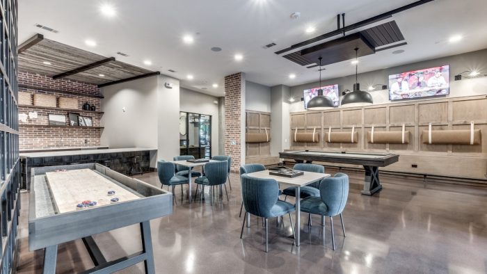 a game room with a pool table, bar and television at The Cedar at  Branch