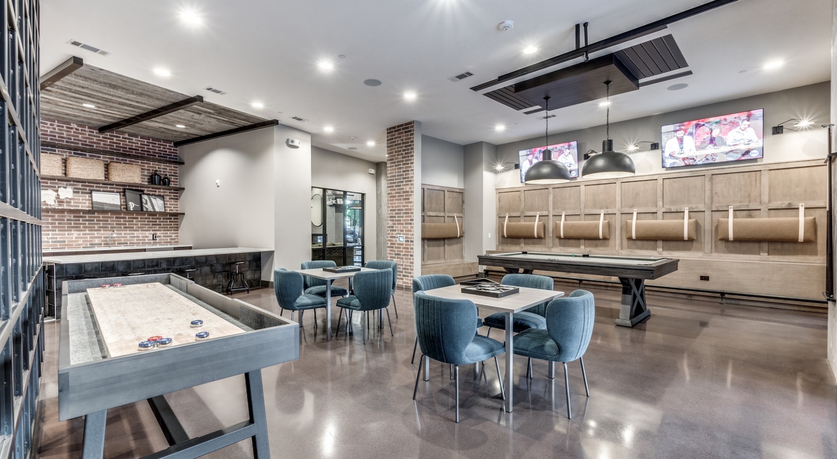 a game room with a pool table, bar and television at The Cedar at  Branch