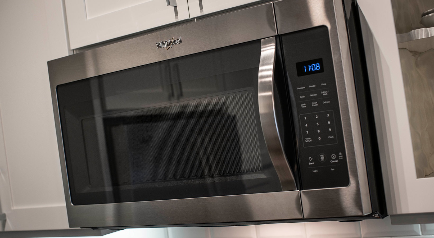 a stainless steel microwave oven in a kitchen at The Cedar at  Branch